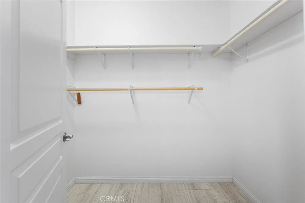 16222 Monterey Lane, Unit 285 Huntington Beach, CA 92649 - Photo 26 of 59 a view of walk in closet with empty racks