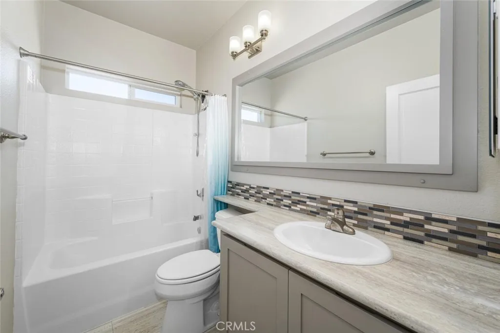 16222 Monterey Lane, Unit 285 Huntington Beach, CA 92649 - Photo 27 of 59 a bathroom with a sink toilet and shower