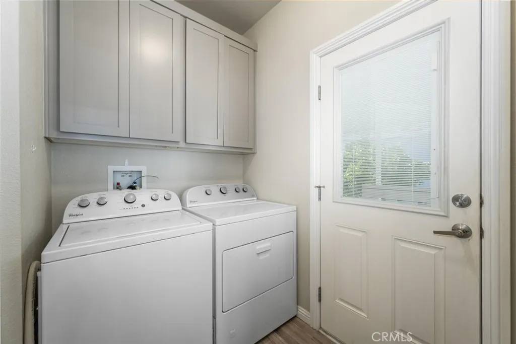 16222 Monterey Lane, Unit 285 Huntington Beach, CA 92649 - Photo 37 of 59 a view of storage and utility room with washer and dryer