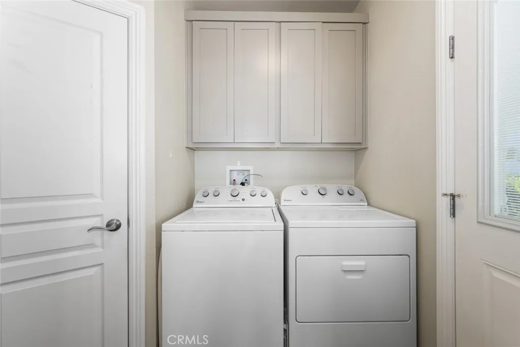 16222 Monterey Lane, Unit 285 Huntington Beach, CA 92649 - Photo 38 of 59 a view of storage and utility room with washer and dryer