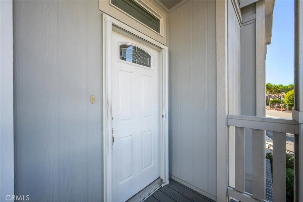 16222 Monterey Lane, Unit 285 Huntington Beach, CA 92649 - Photo 46 of 59 a view of a hallway with wooden floor and entryway