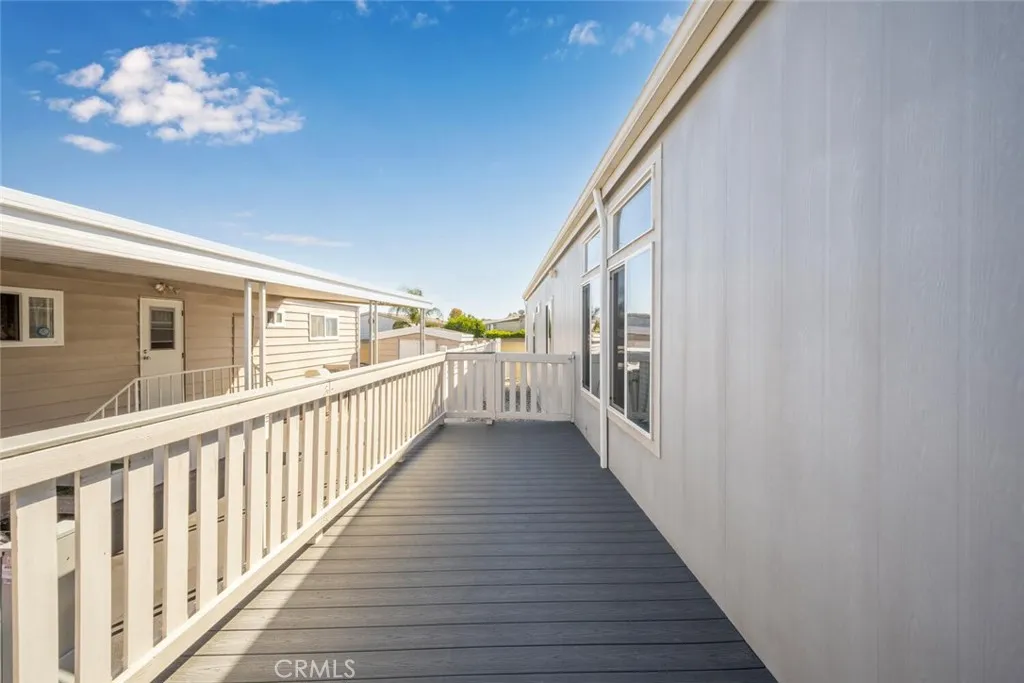 16222 Monterey Lane, Unit 285 Huntington Beach, CA 92649 - Photo 48 of 59 a view of a house with stairs and wooden floor