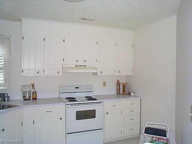 1495 Pebblebrook Road Winston-Salem, NC 27105 - Photo 4 of 7 Other. bright, white kitchen