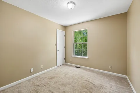 an empty room with a empty space and a window