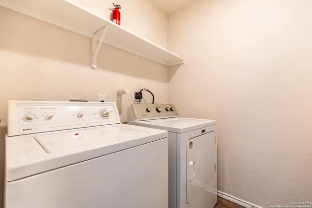 a utility room with dryer and washer