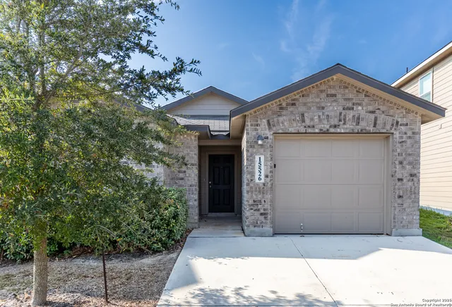a view of a house with a small yard