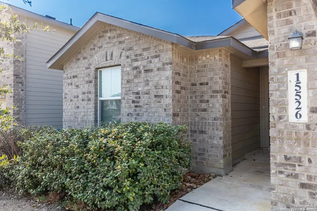 a brick building with a yard