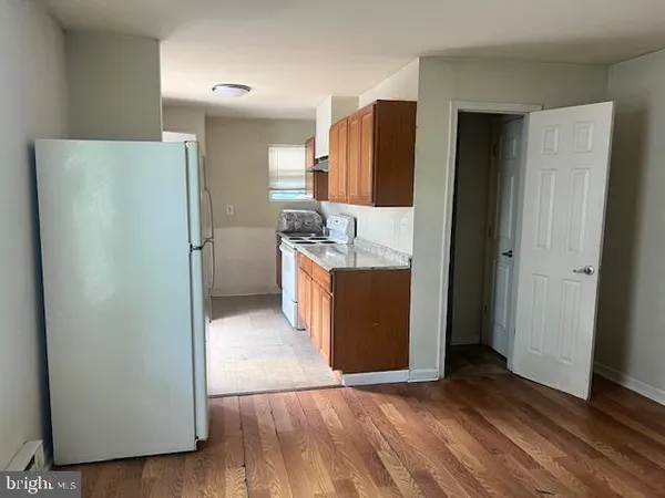 a kitchen with stainless steel appliances a refrigerator and a stove