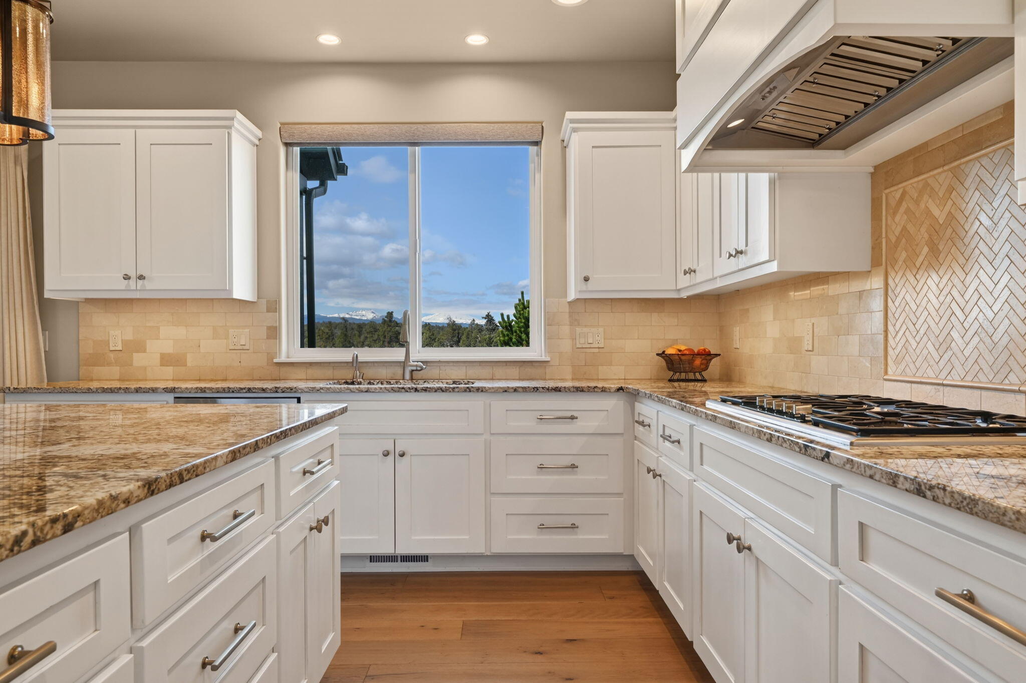 66355 Barr Road Bend, OR 97703 - Photo 15 of 56 a kitchen with granite countertop white cabinets and white appliances