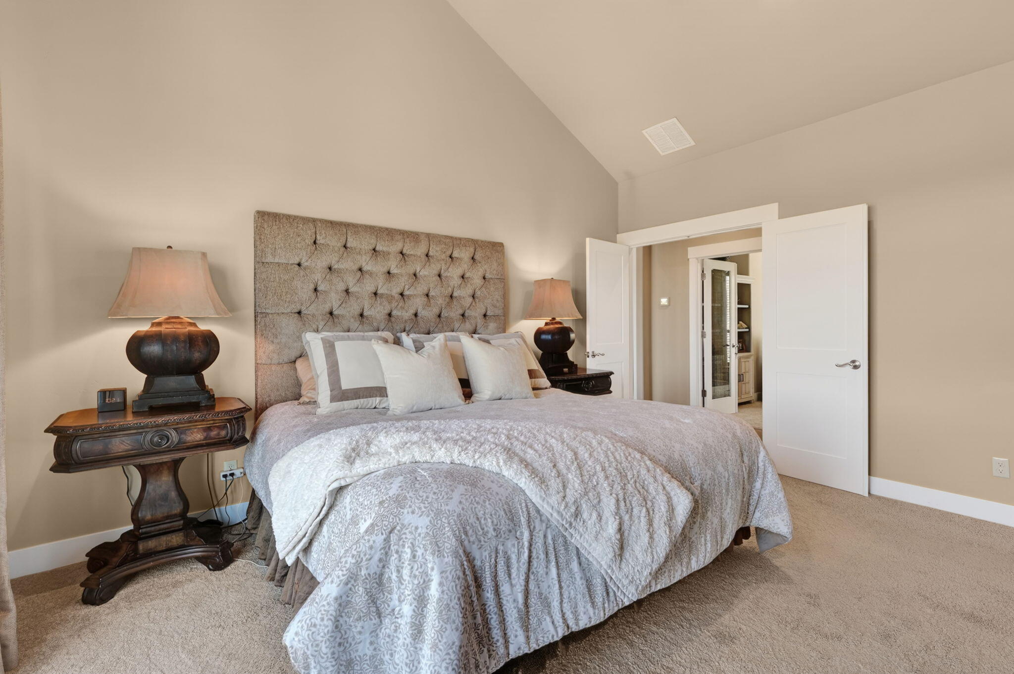 66355 Barr Road Bend, OR 97703 - Photo 21 of 56 a bedroom with a bed and a chair in it
