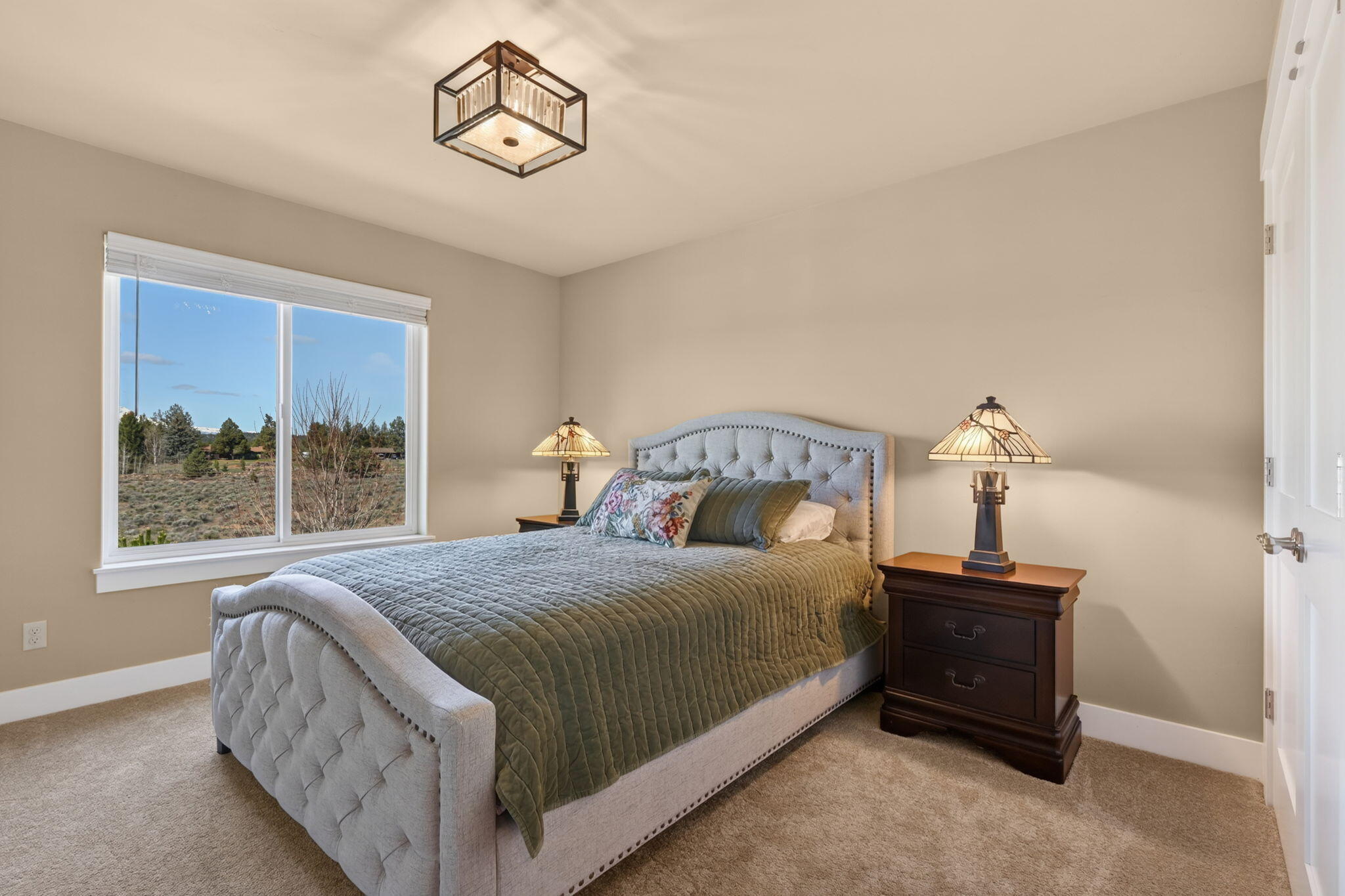 66355 Barr Road Bend, OR 97703 - Photo 33 of 56 a bedroom with a bed and a window