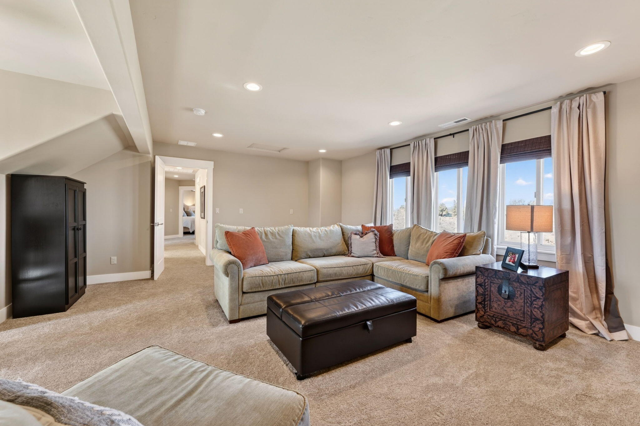 66355 Barr Road Bend, OR 97703 - Photo 39 of 56 a living room with furniture and a flat screen tv