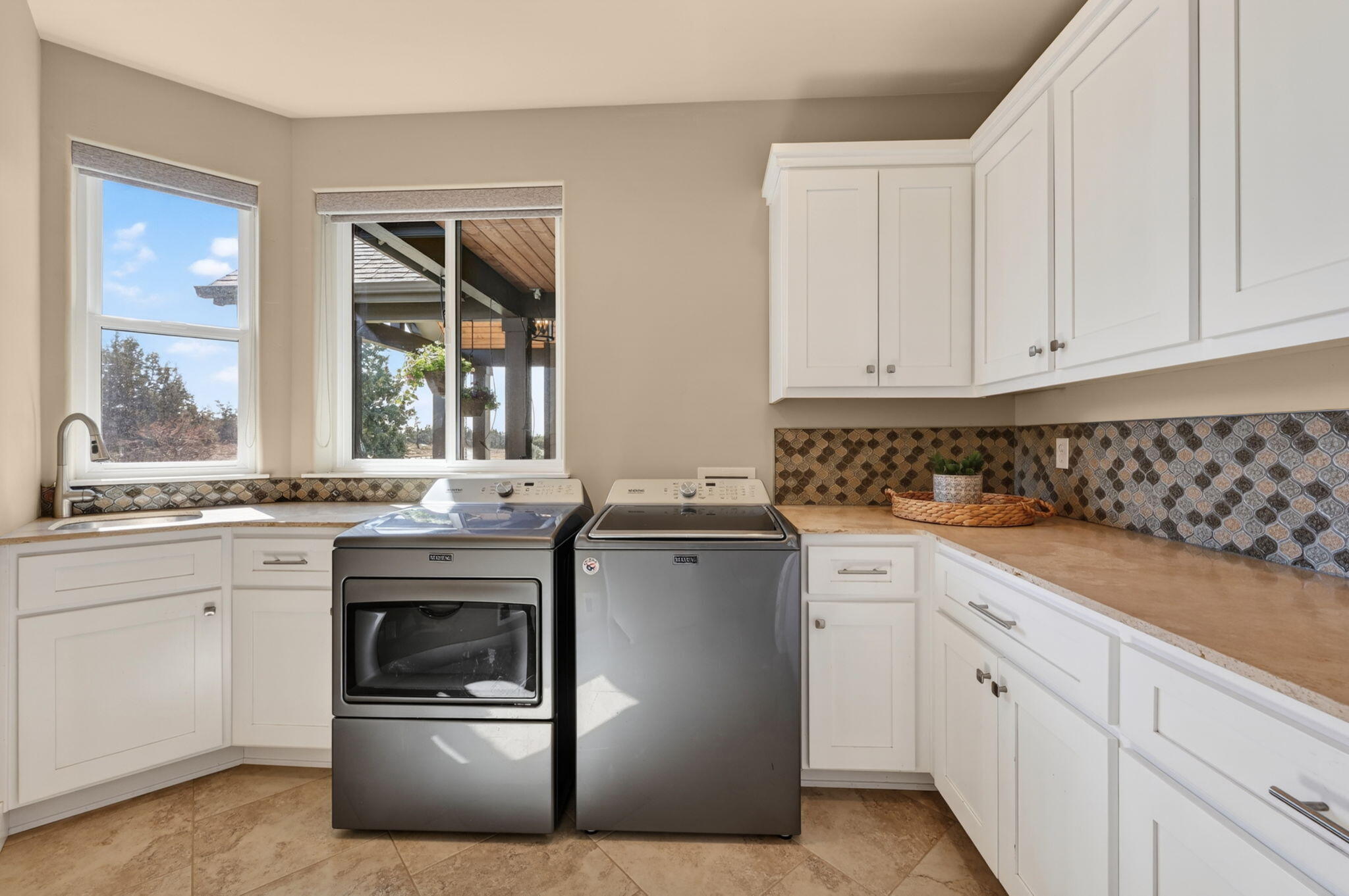 66355 Barr Road Bend, OR 97703 - Photo 41 of 56 a kitchen with white cabinets and white appliances