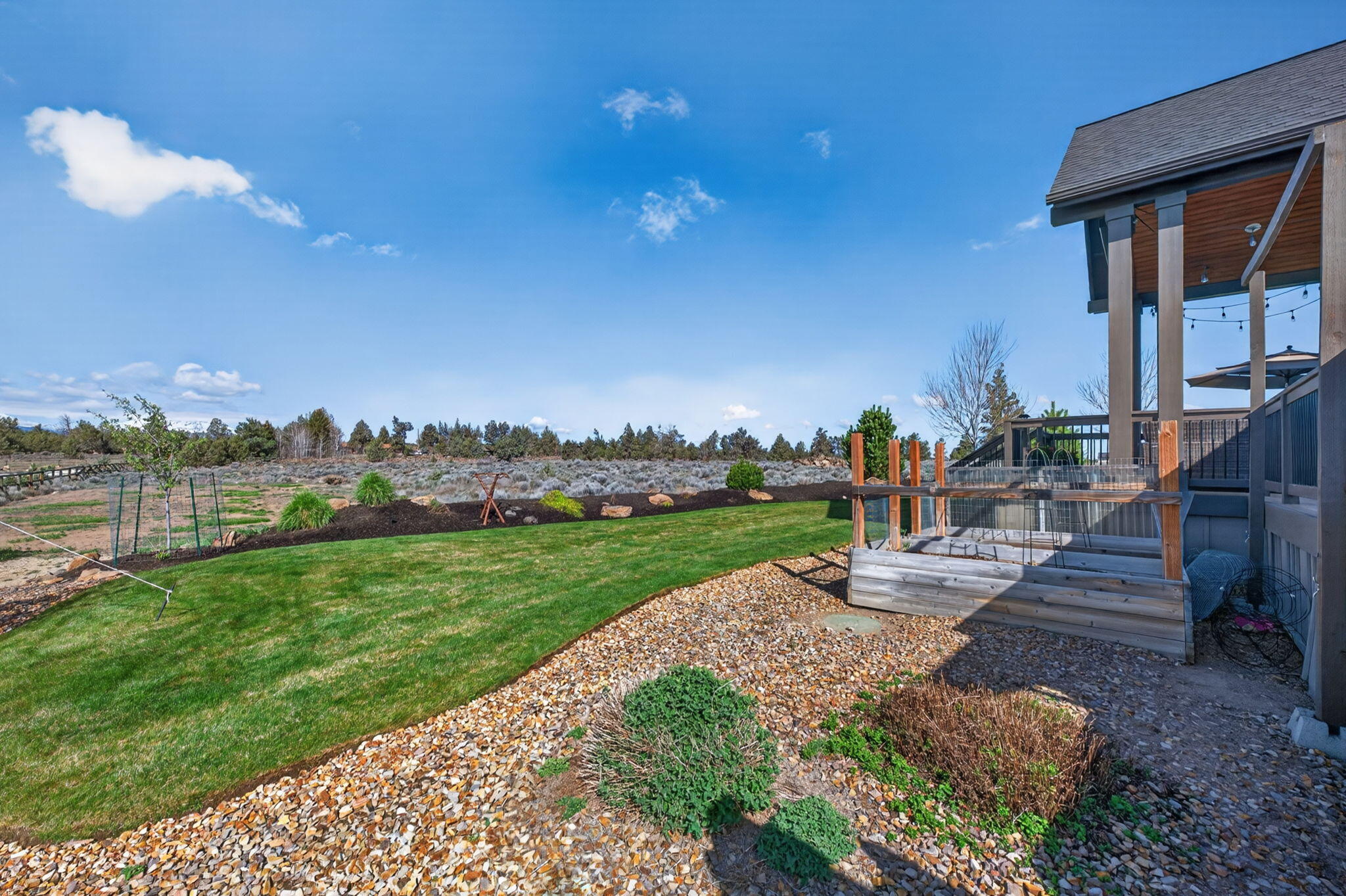 66355 Barr Road Bend, OR 97703 - Photo 47 of 56 a view of a garden with lawn chairs