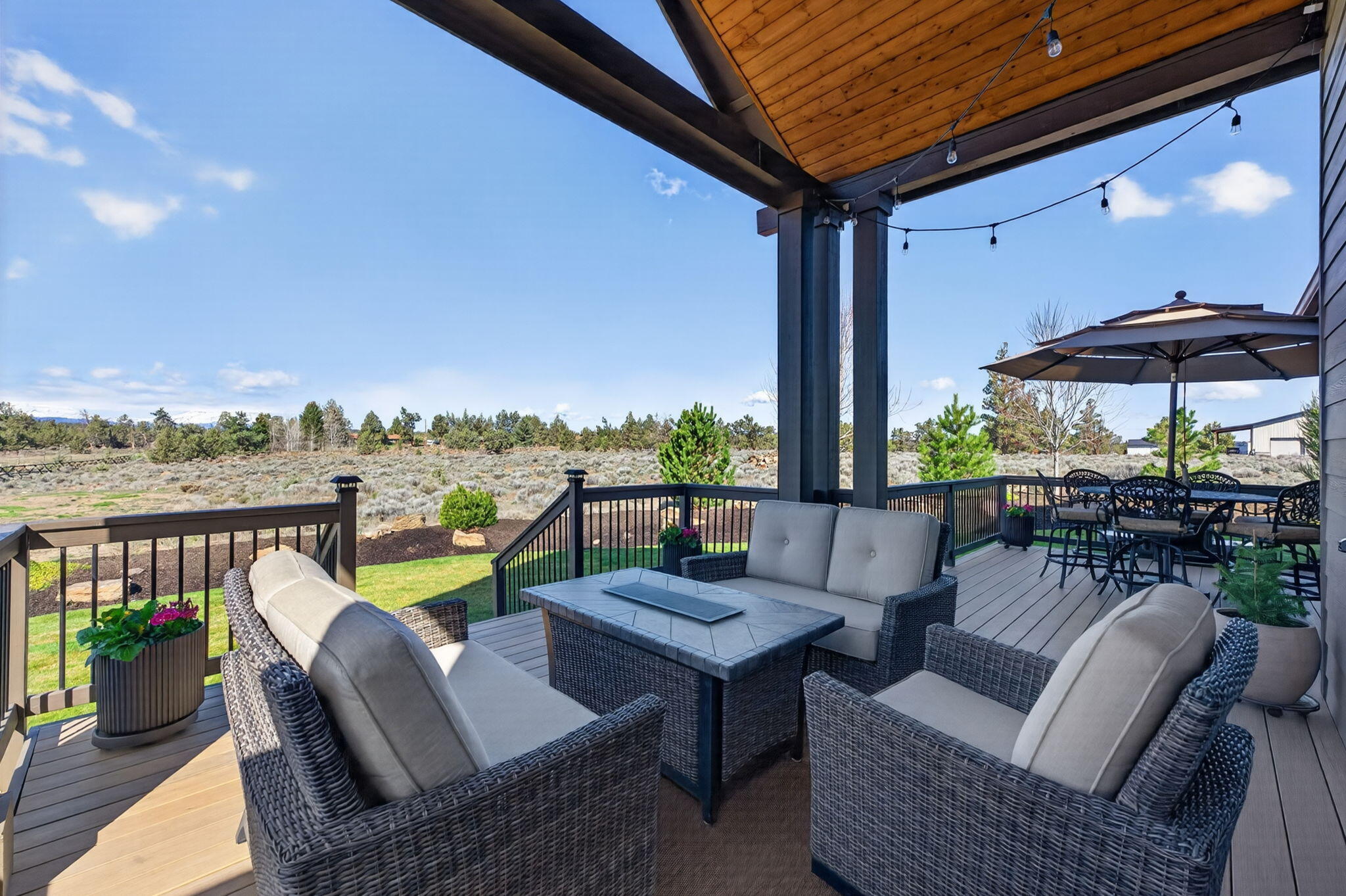 66355 Barr Road Bend, OR 97703 - Photo 56 of 56 a view of a patio with couches chairs and a table