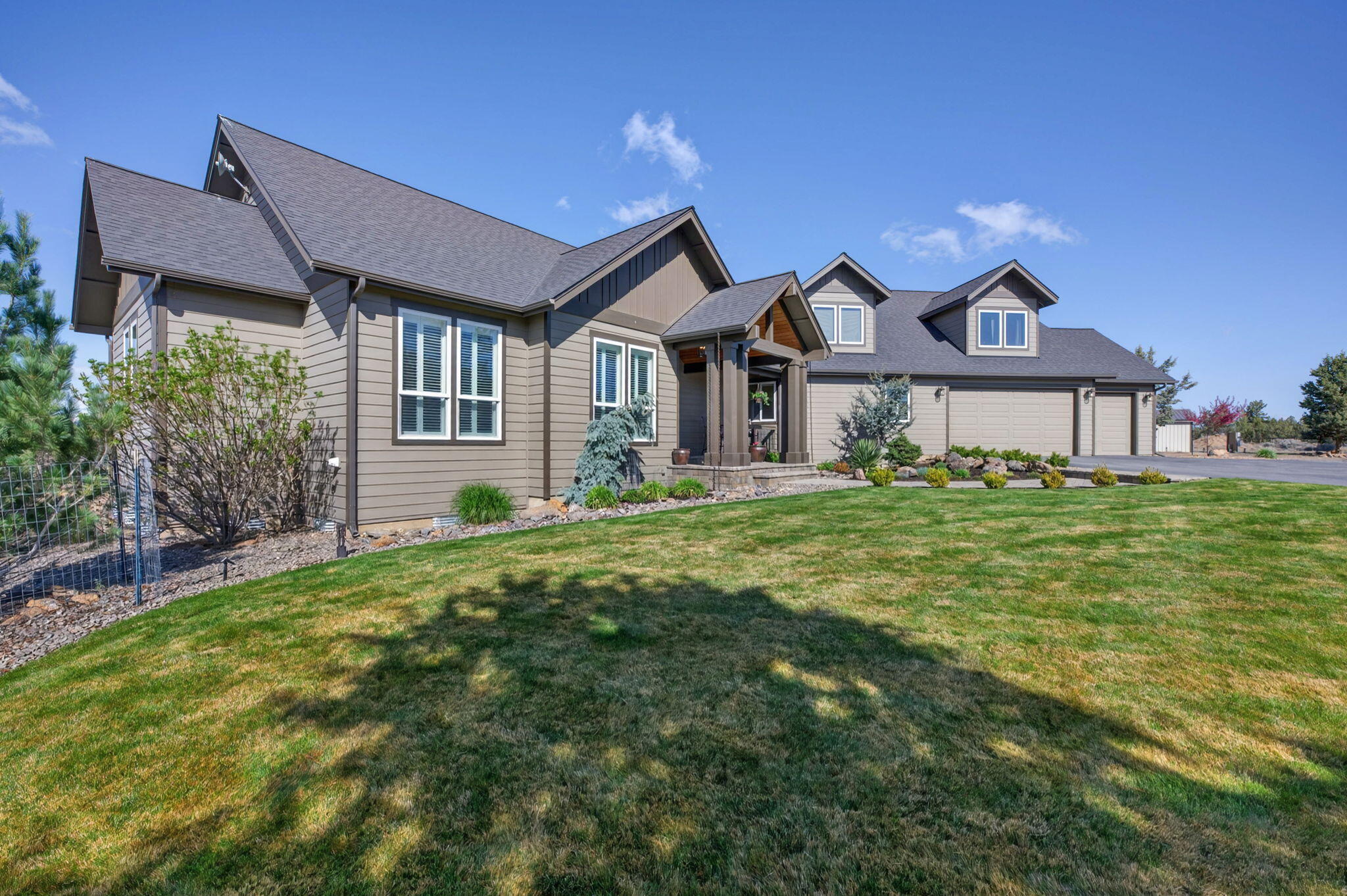 66355 Barr Road Bend, OR 97703 - Photo 6 of 56 a front view of a house with garden