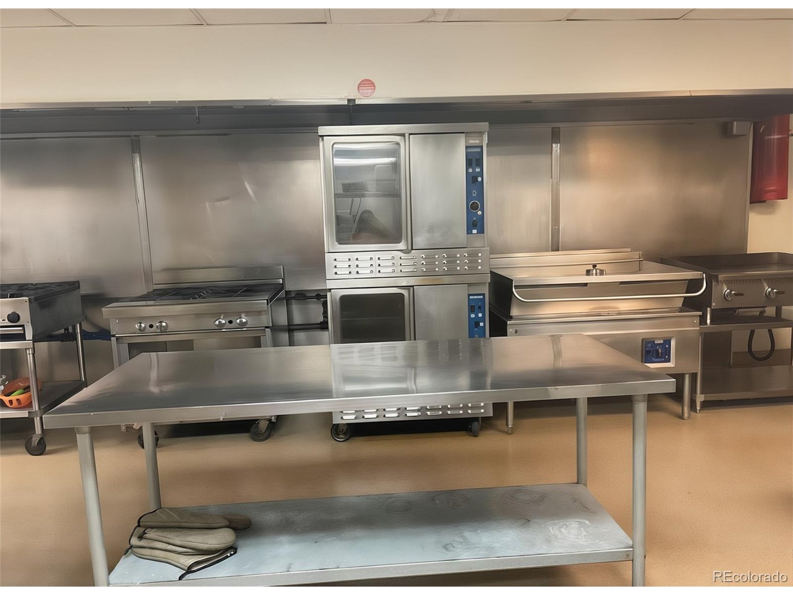 536 Cherokee Street Denver, CO 80204 - Photo 23 of 37 a kitchen with a stove and a view of living room