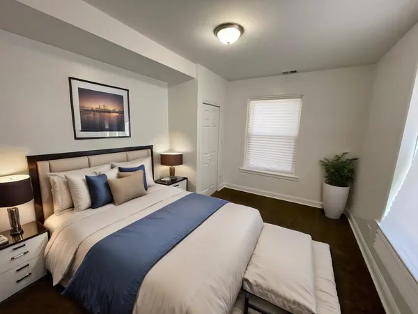 a bedroom with a bed and a window