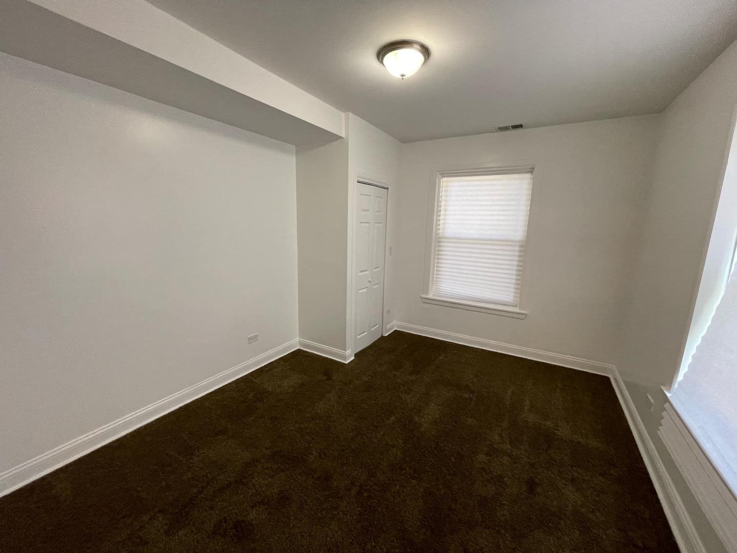 1635 West 57th Street, Unit 1 Chicago, IL 60636 - Photo 16 of 16 an empty room with a window