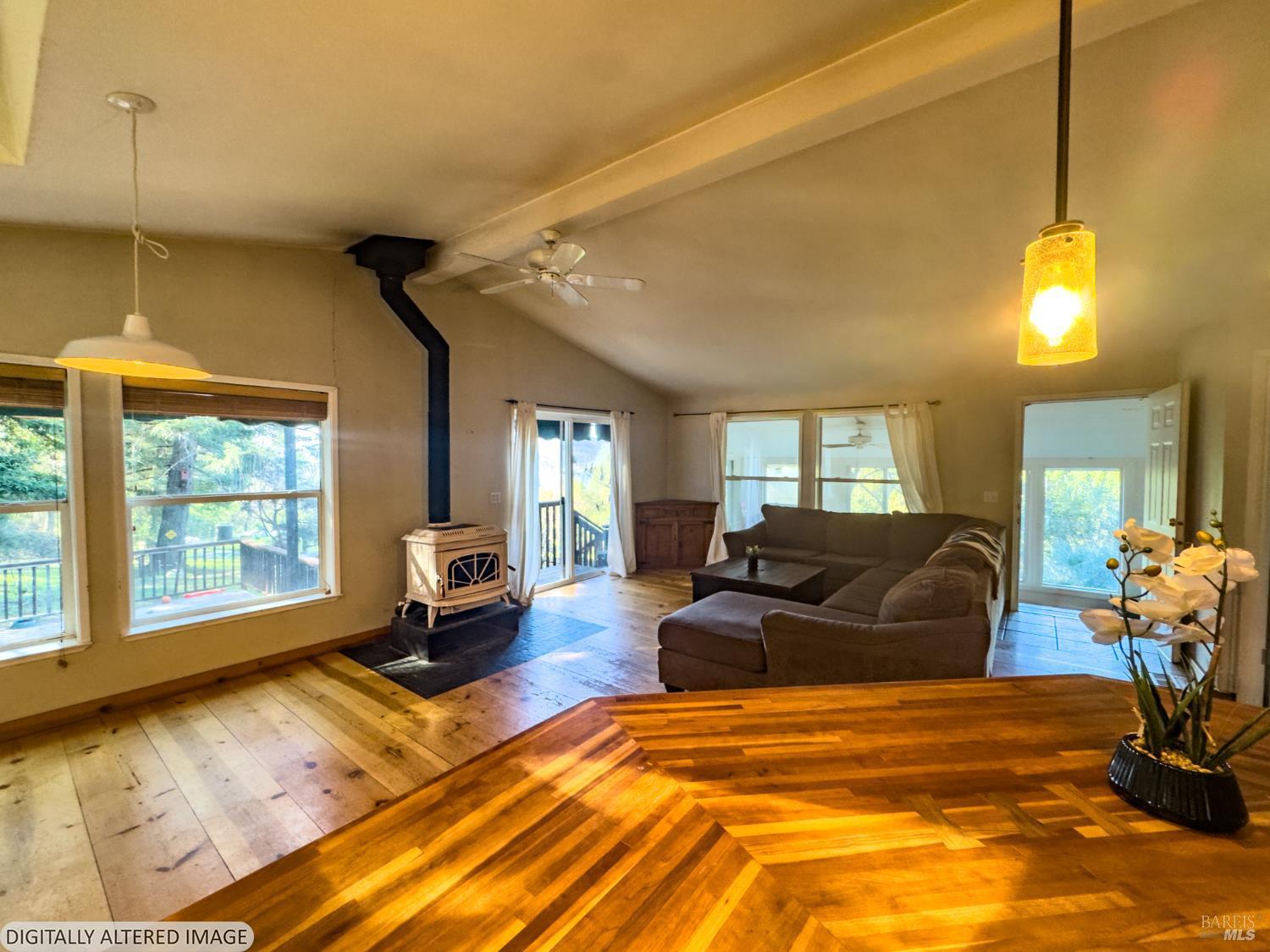 14475 Poonkinney Road Dos Rios, CA 95429 - Photo 4 of 25 a bedroom with a bed window and couch