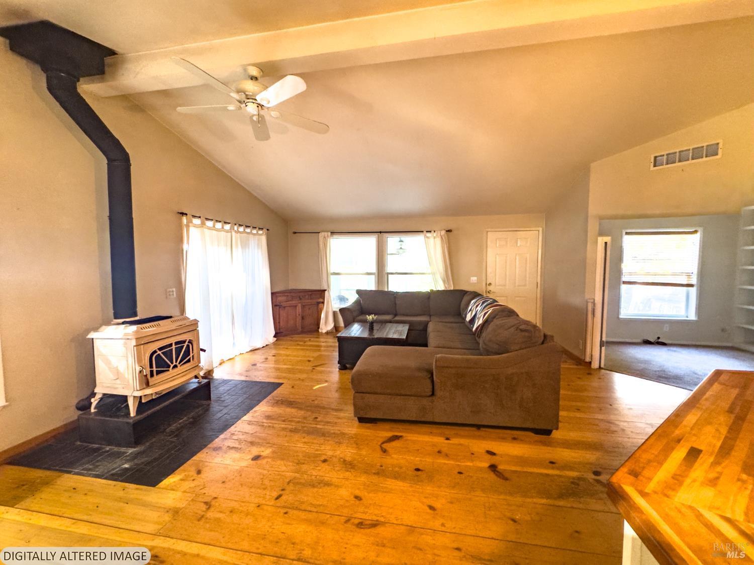 14475 Poonkinney Road Dos Rios, CA 95429 - Photo 5 of 25 a living room with furniture and a flat screen tv