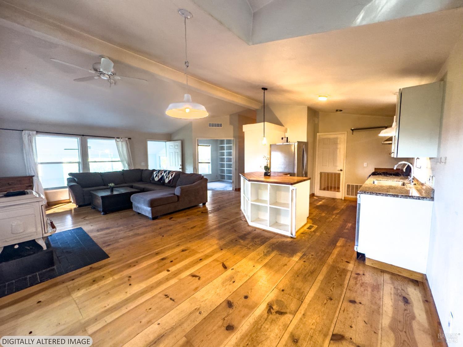 14475 Poonkinney Road Dos Rios, CA 95429 - Photo 8 of 25 a living room with furniture and kitchen view