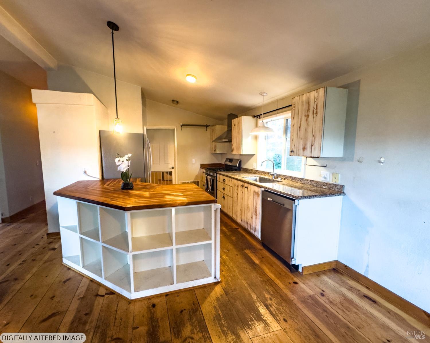 14475 Poonkinney Road Dos Rios, CA 95429 - Photo 10 of 25 a kitchen with stainless steel appliances granite countertop a stove a sink and a refrigerator