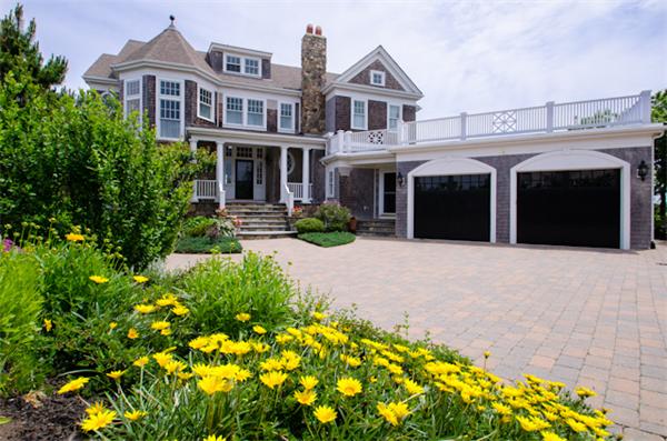 369 Jerusalem Road Cohasset, MA 02025 - Photo 2 of 30 a front view of a house with a yard and garage