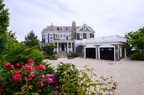 369 Jerusalem Road Cohasset, MA 02025 - Photo 3 of 30 a front view of a house with a yard and flowers