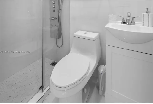 a bathroom with a toilet and a sink