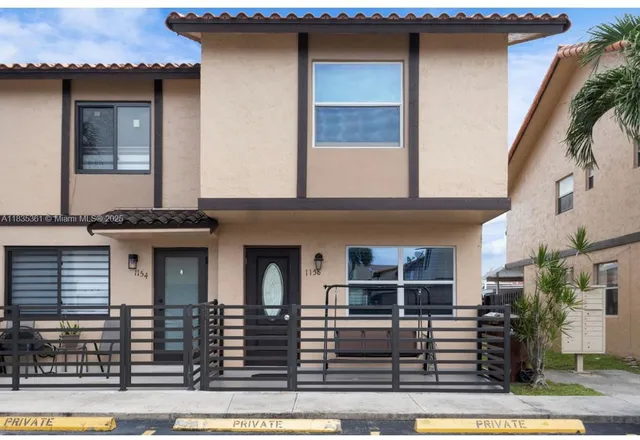 a front view of a house with garage