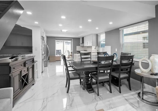 a view of a dining room with furniture