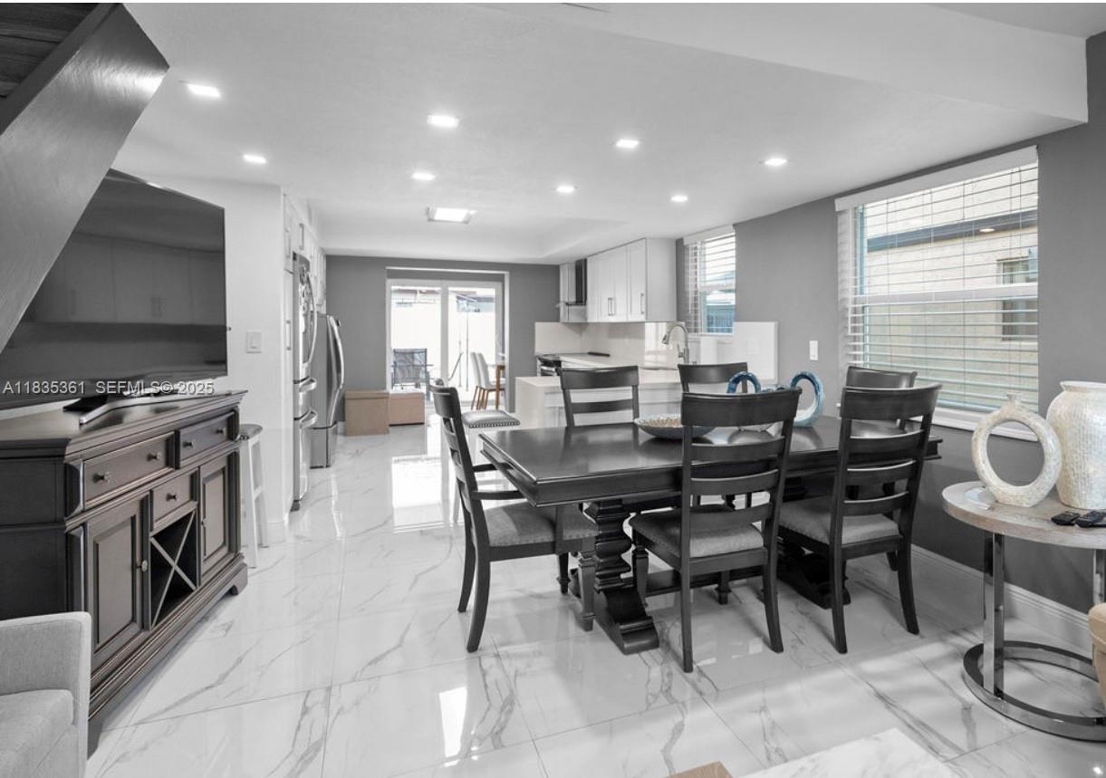 1158 West 41st Street, Unit 87 Hialeah, FL 33012 - Photo 5 of 16 a view of a dining room with furniture