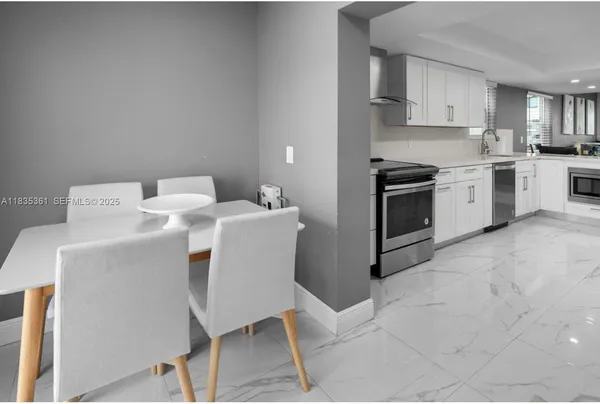 a kitchen with a sink cabinets and appliances