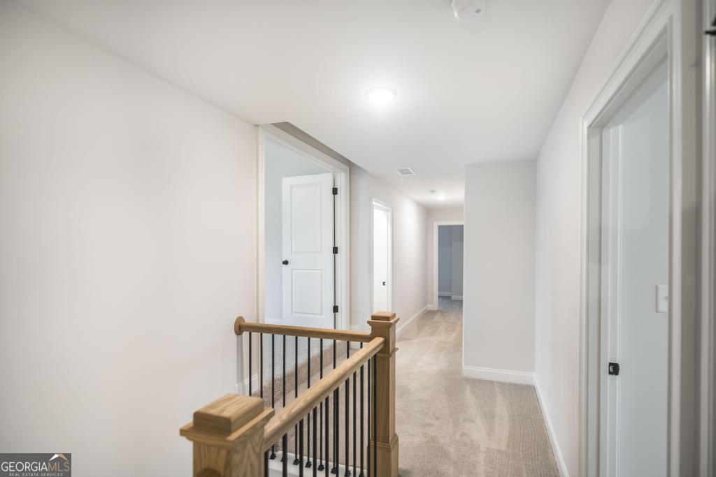 409 Bella Notte Circle, Unit 1D Warner Robins, GA 31088 - Photo 18 of 34 a view of a hallway