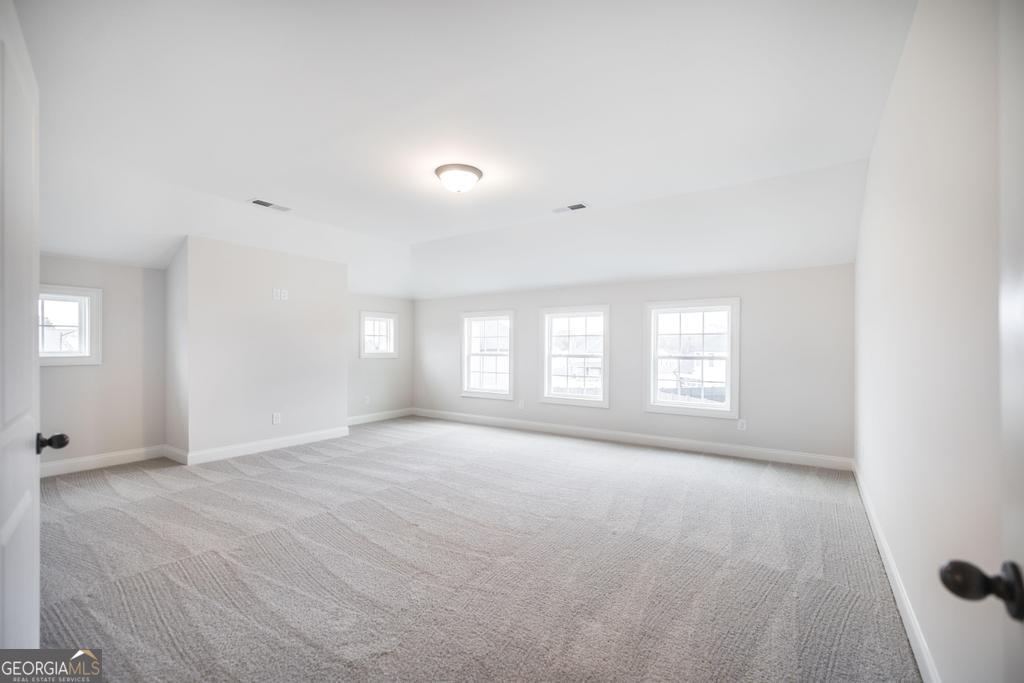 409 Bella Notte Circle, Unit 1D Warner Robins, GA 31088 - Photo 25 of 34 a view of an empty room with a window