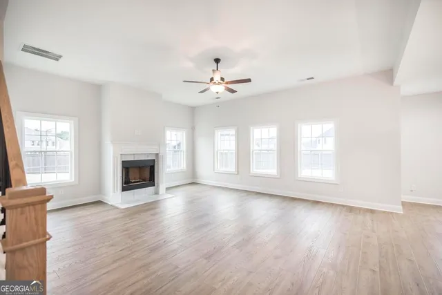 a view of kitchen with cabinets and wooden floor