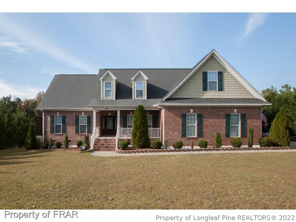 510 Booth Pond Road Raeford, NC 28376 - Photo 1 of 36 a front view of a house with lots of trees