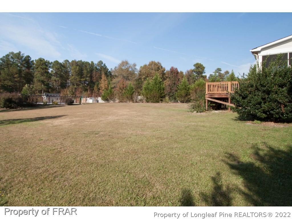 510 Booth Pond Road Raeford, NC 28376 - Photo 12 of 36 a view of an outdoor space and a yard