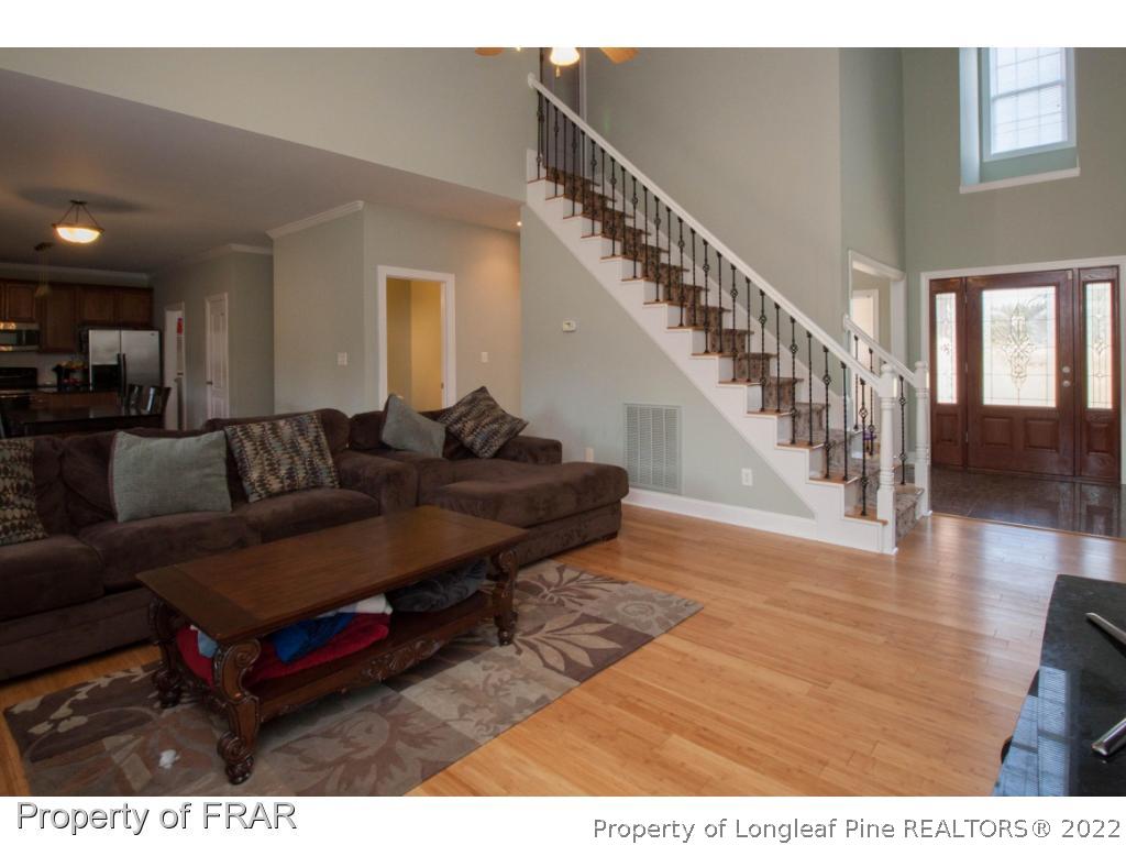 510 Booth Pond Road Raeford, NC 28376 - Photo 13 of 36 a living room with furniture and a wooden floor