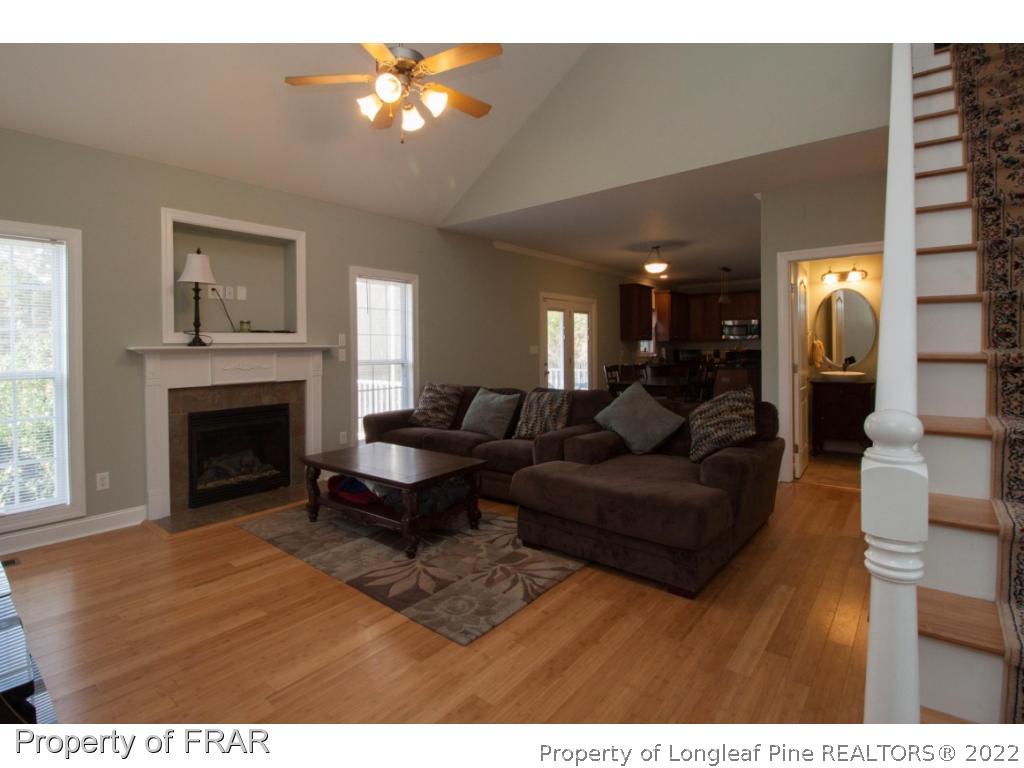 510 Booth Pond Road Raeford, NC 28376 - Photo 14 of 36 a living room with furniture and a fireplace