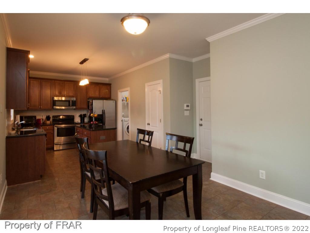 510 Booth Pond Road Raeford, NC 28376 - Photo 17 of 36 a view of a dining room with furniture