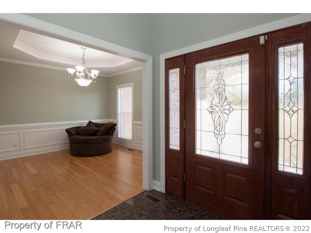 510 Booth Pond Road Raeford, NC 28376 - Photo 20 of 36 a living room with furniture and a large window