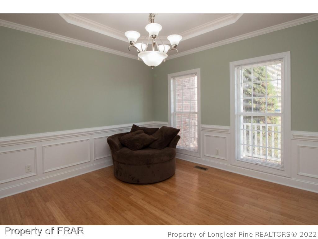 510 Booth Pond Road Raeford, NC 28376 - Photo 21 of 36 a view of a livingroom with furniture and chandelier