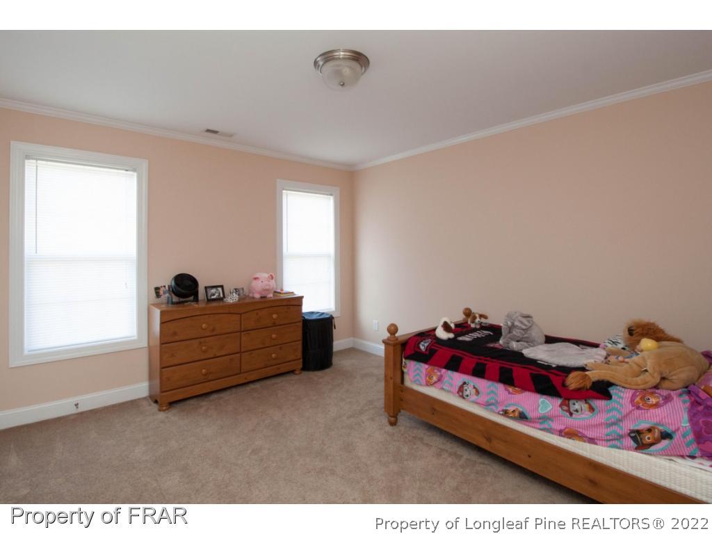 510 Booth Pond Road Raeford, NC 28376 - Photo 30 of 36 a room with furniture and window