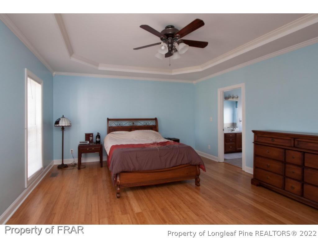 510 Booth Pond Road Raeford, NC 28376 - Photo 36 of 36 a bedroom with a bed and a dresser