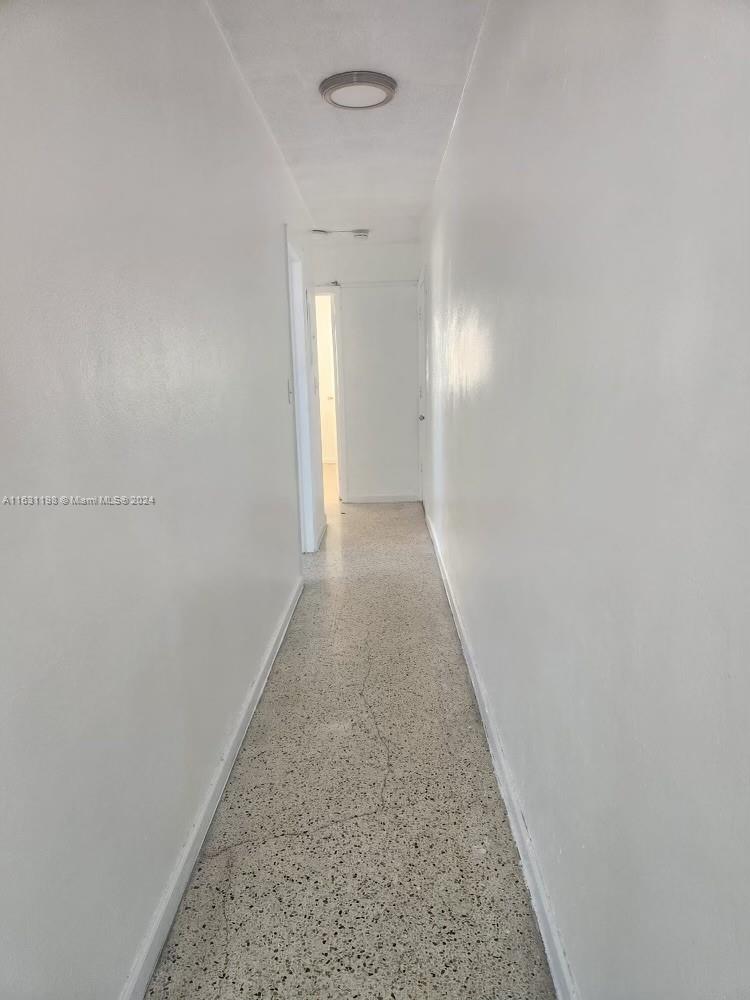 10 Northwest 48th Place, Unit 1 Miami, FL 33126 - Photo 7 of 10 a view of a hallway