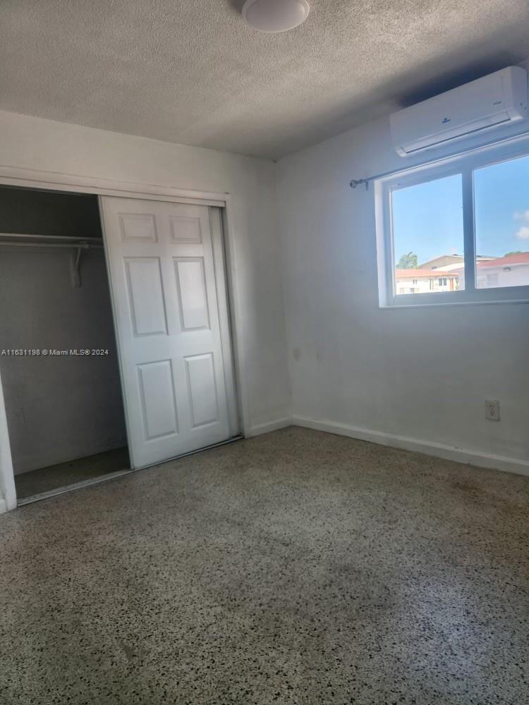 10 Northwest 48th Place, Unit 1 Miami, FL 33126 - Photo 8 of 10 an empty room with windows