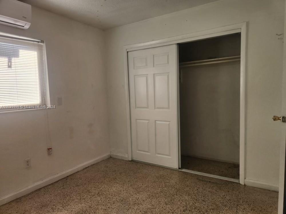 10 Northwest 48th Place, Unit 1 Miami, FL 33126 - Photo 10 of 10 an empty room with closet