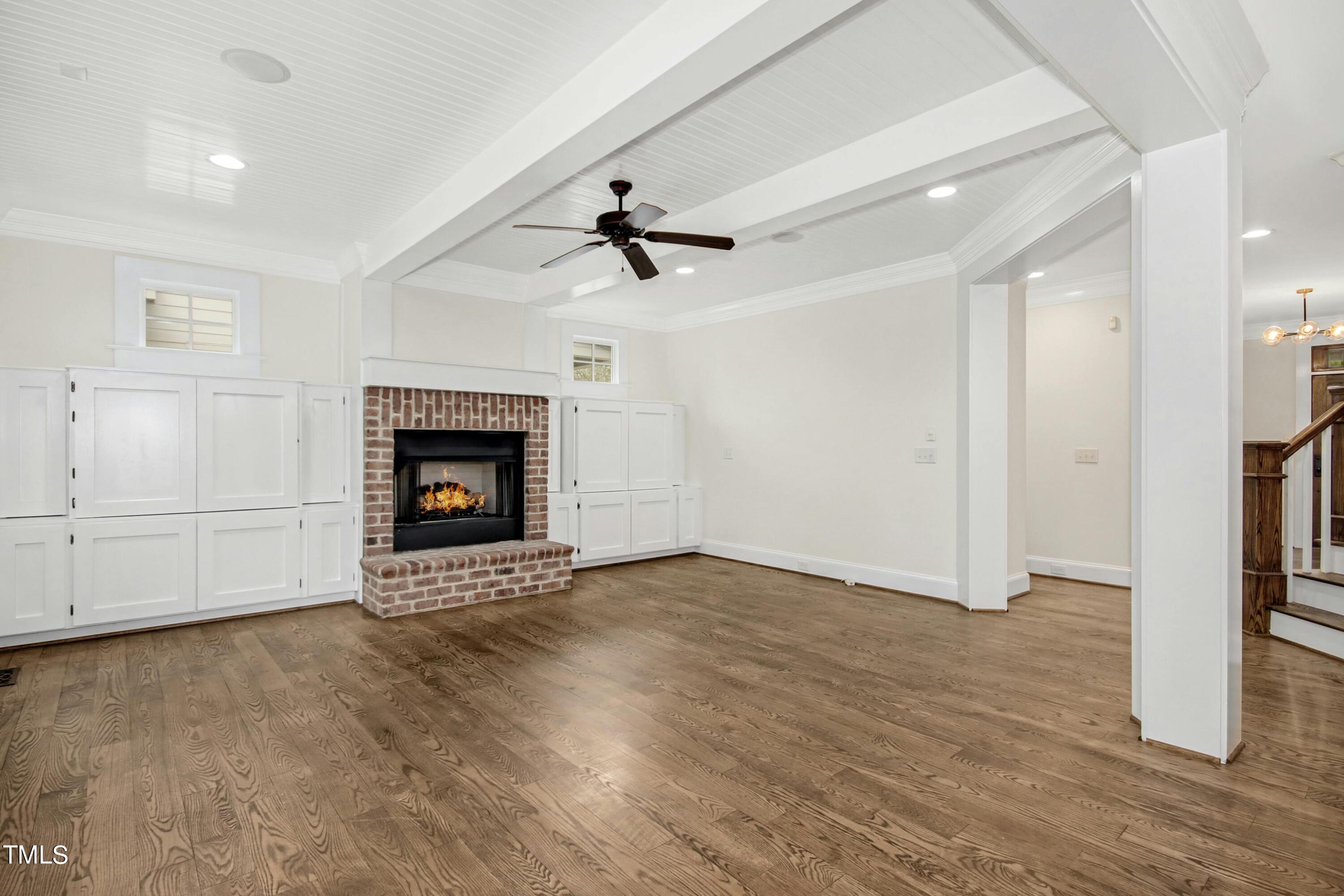 512 Peebles Street Raleigh, NC 27608 - Photo 11 of 45 an empty room with windows and fireplace
